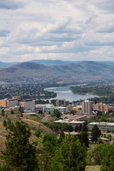 Obraz premium Aerial view of Kamloops City during a cloudy summer day. Located in Interior BC, Canada.