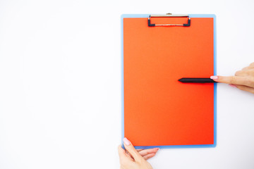 Blank Folder with Red Paper. Hand that Holding Folder and Pen on White Background. Copyspace. Place for Text