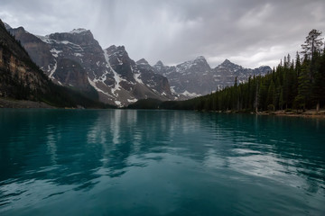 Beautiful Canadian Rockies during a cloudy and rainy evening. Taken in Moraine Lake, Banff National Park, Alberta, Canada.
