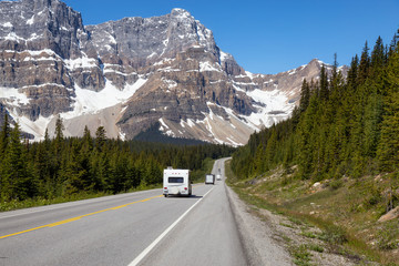 Road in Icefields Parkway during a vibrant sunny summer day. Taken in Banff National Park, Alberta,...