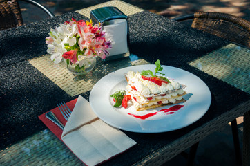 mille-feuille on a serving table on the summer restaurant grounds