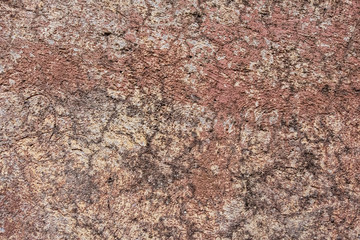 Wallpaper background of worn red concrete wall background texture.