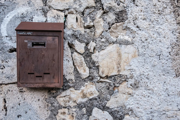 Wallpaper background of a mailbox on a wall. No people.