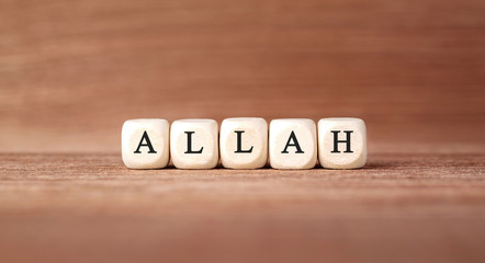 Word ALLAH made with wood building blocks