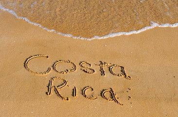 Costa rica word on sandy beach