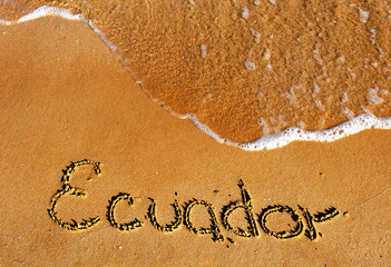 Fototapeta premium Ecuador word on sandy beach background