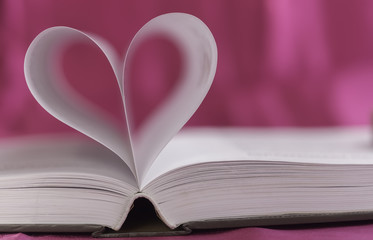 Open book with heart shape