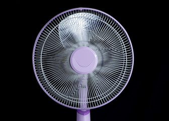 electric floor fan isolated on black background