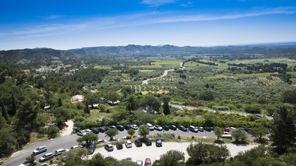 Fototapeta na wymiar View from the fortress Les Baux-de-Provence into the valley on olive groves in the background the Alpilles. Bouches du Rhone, Provence, France, Europe.