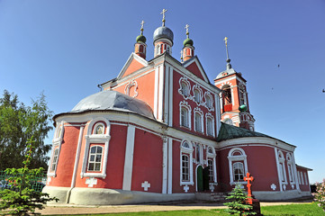 Fototapeta na wymiar Facade of beautiful red stone orthodox church