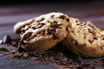 Chocolate cookies on table. Chocolate chip cookies shot with chocolate