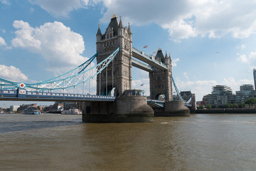 Fototapeta na wymiar Tower Bridge in London with British and Rainbow flags