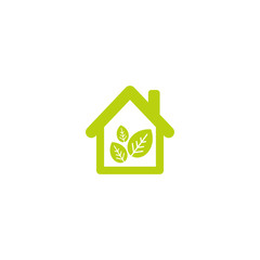 Flat green home with green leaves inside. Simple silhouette of the house with green roof and chimney.