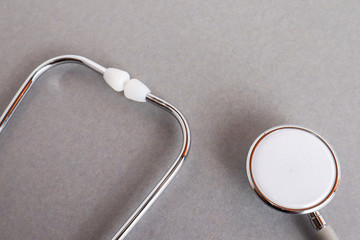 Medical equipments including stethoscope medicines background, top view flat lay