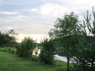 picturesque banks of the river in the summer evening