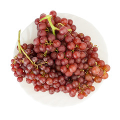 grapes seedless red on dish isolated on white background
