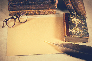 old vintage antique books with textured paper. Eyeglasses. Background. Reading Science and...