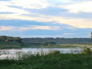 Fototapeta premium evening clouds on the river after sunset