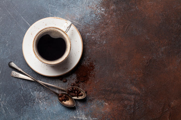 Coffee cup, roasted beans and ground coffee