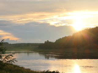 Fototapeta na wymiar sunset over the river in summer