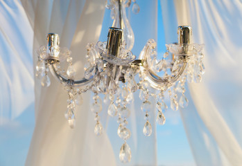 Wedding ceremony with vintage lamp on wedding arch. Rustic style