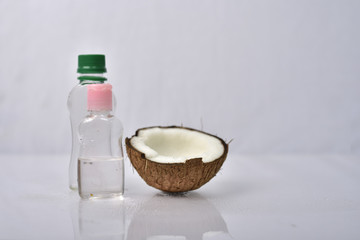Coconut oil with coconut on grey background. 