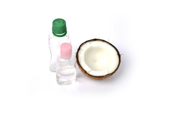 Coconut oil with coconut on white background.