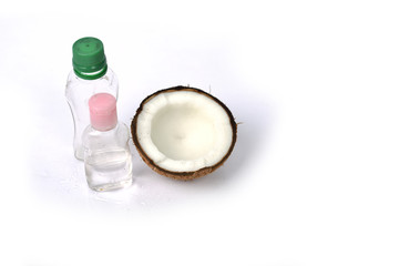 Coconut oil with coconut on white background.