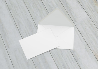 Opened envelope with blank card. Blank envelope with post card on dark background.