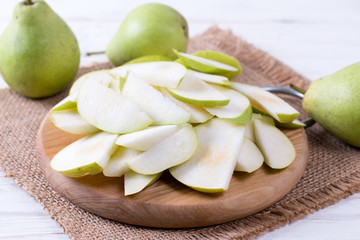 Cut pears on wooden board