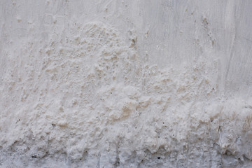 White concrete wall texture and uneven surface.