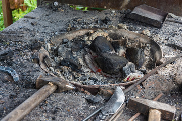 Fototapeta premium A small forge with red burning coals.