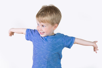 Portrait of cheerful kid boy showing something big with his hands - isolated over white background