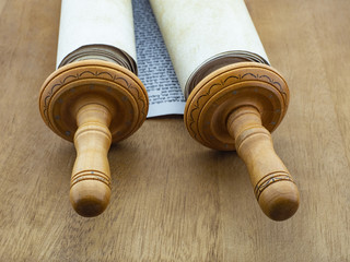 A fragment of the scrolls trory on a wooden table.