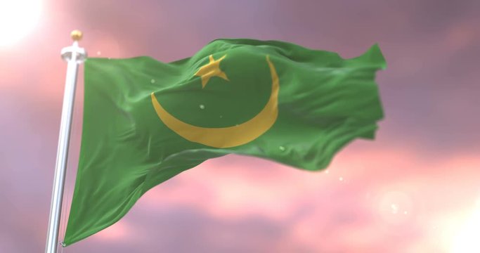 Flag of Mauritania waving at wind with blue sky in slow, loop