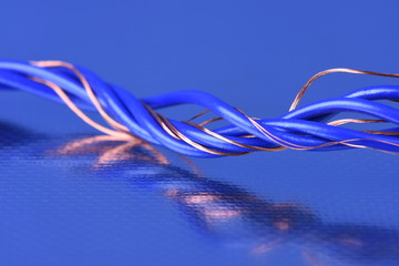 Obraz na płótnie Canvas Swirl of Electrical Cable on Metal Background