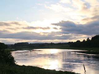 Fototapeta na wymiar sunset over the river in summer