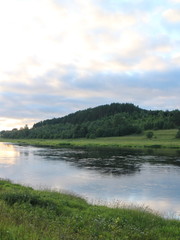 picturesque banks of the river in the summer evening