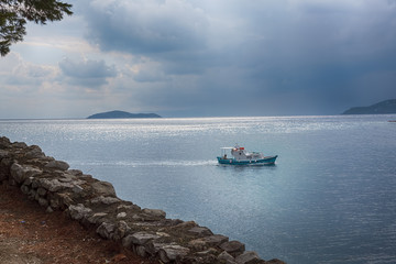 Panoramic of a beautiful Greek Island with the boat