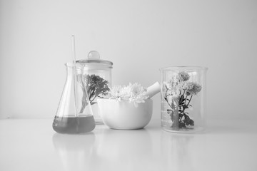 cosmetic skincare beauty product .natural organic flower oil ingredient in the laboratory. packaging spa concept.