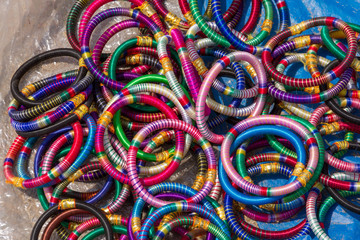 Colorful cloth bangles handmade in India and used as bracelets, cheap, bright and personal jewelery or accessory