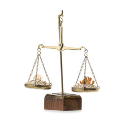 Scales of justice with sand and sea shells for judiciary holiday concept. 