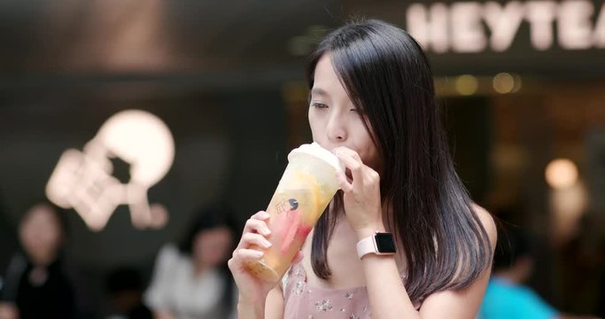 Woman enjoy iced tea take away in shenzhen city