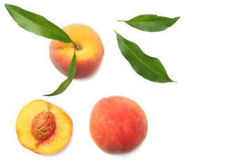 peach fruit with green leaf and slices isolated on white background. top view