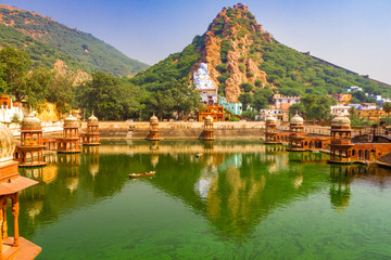Green lake next to Alwar City Palace with a view of the mountains and Bachelor fortress