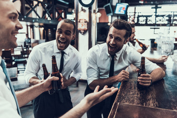 Smiling Young Men Drinking Beer and Have Fun.