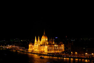 Fototapeta premium amazing night view of old parliament building and river and city lights in Budapest city, travel concept, space for text