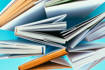 Books from above on blue background