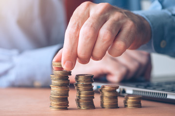 Coin stacker, businessman with stacked money