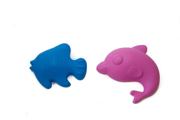 Shaped sandstone and kinetic sand toys. Children's entertainment. Sand molds on white background